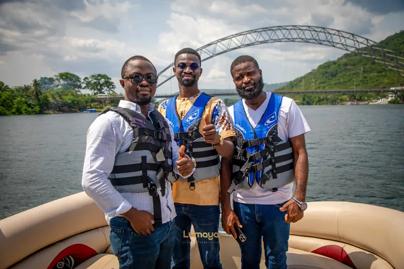 On the water, with the bridge behind
