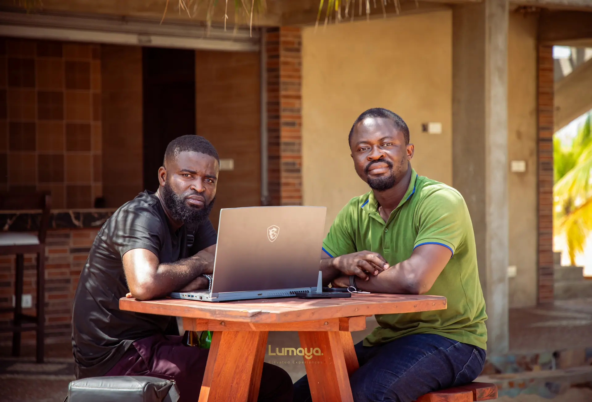 Two professionals working together at a lakeside lodge